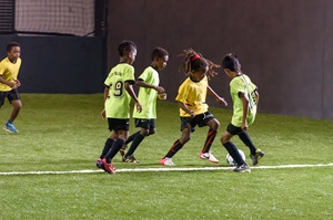 Kids enjoying their football match on a field