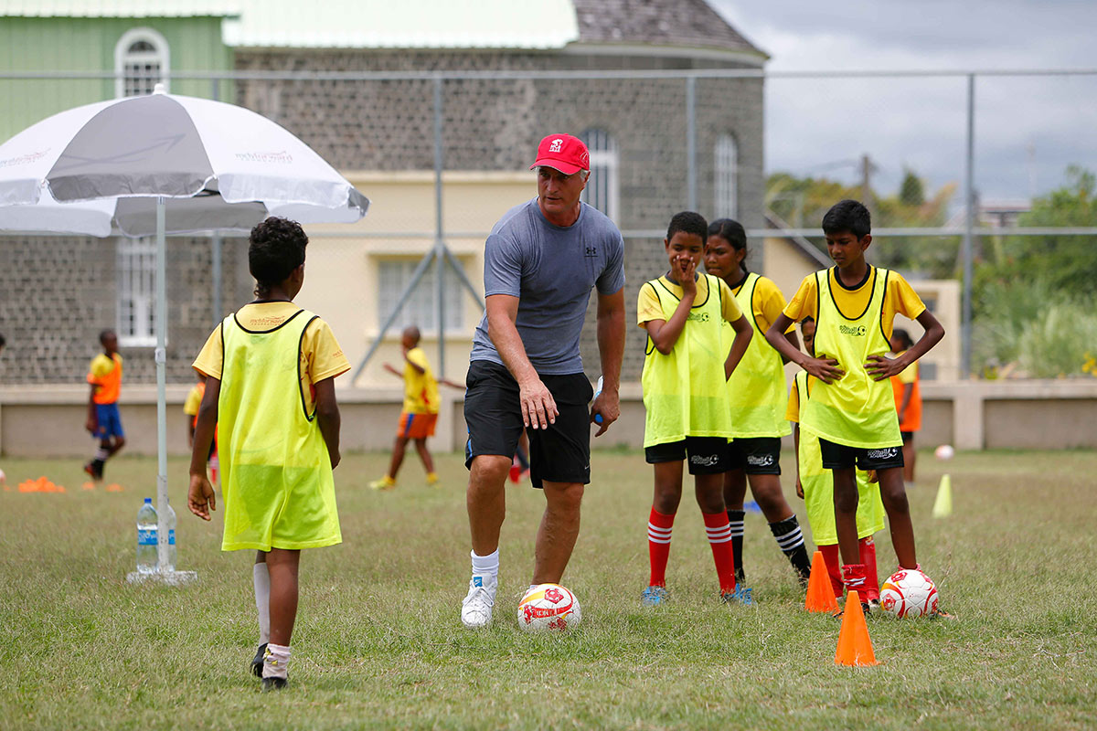David Ginola training children playing football