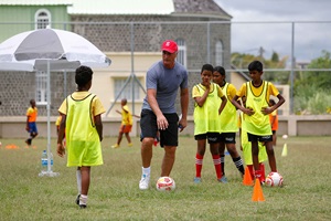 David Ginola training children playing football